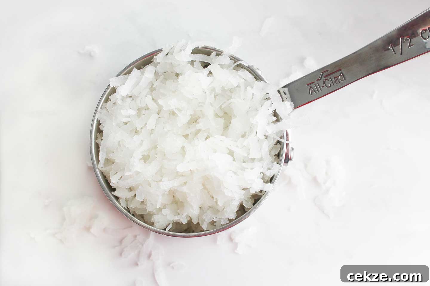 Coconut flakes in a measuring cup