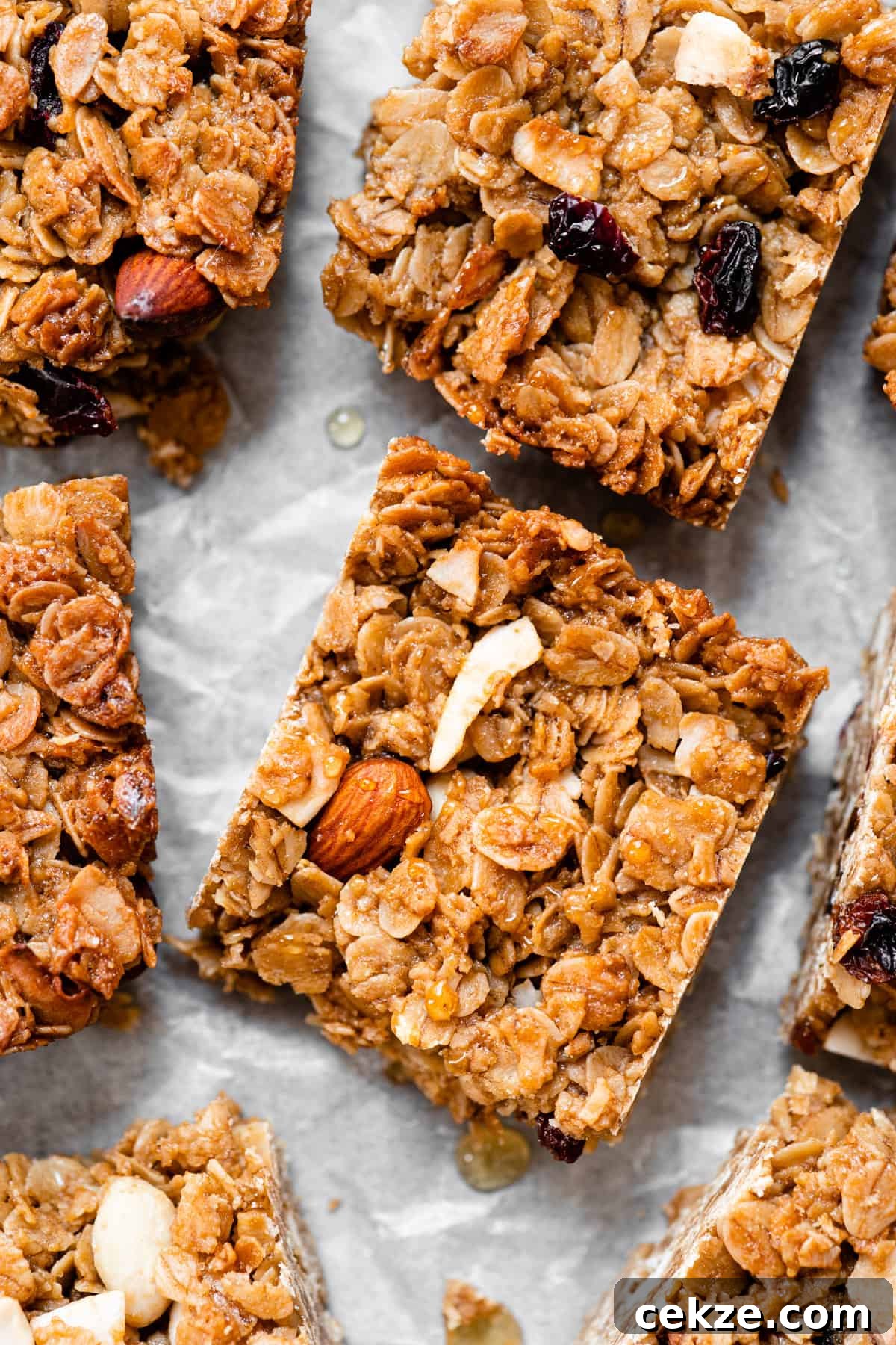 Chewy Oat Flapjacks with Berries and Maple Glaze 5 Healthy flapjacks cut into squares with nuts and dried fruit.