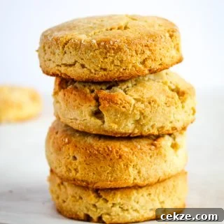almond flour biscuits stacked on a white counter
