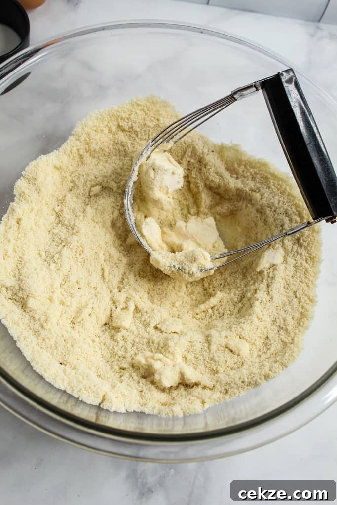 Almond Flour Biscuits cutting in butter