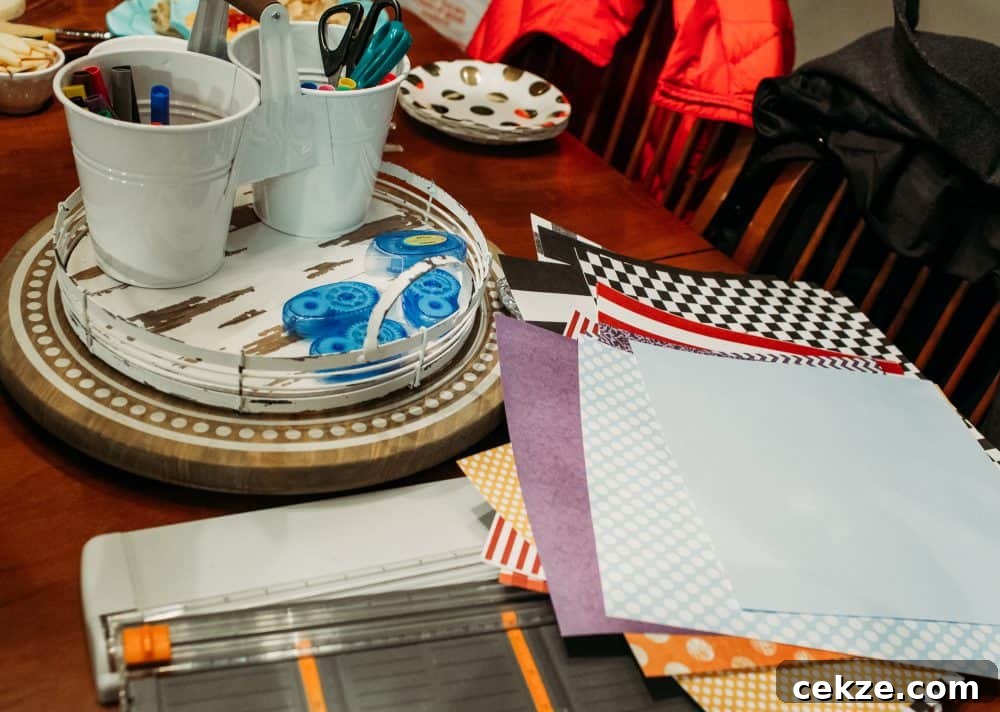 patterned paper, paper trimmers, markers, pens, scissors, and adhesive on a table