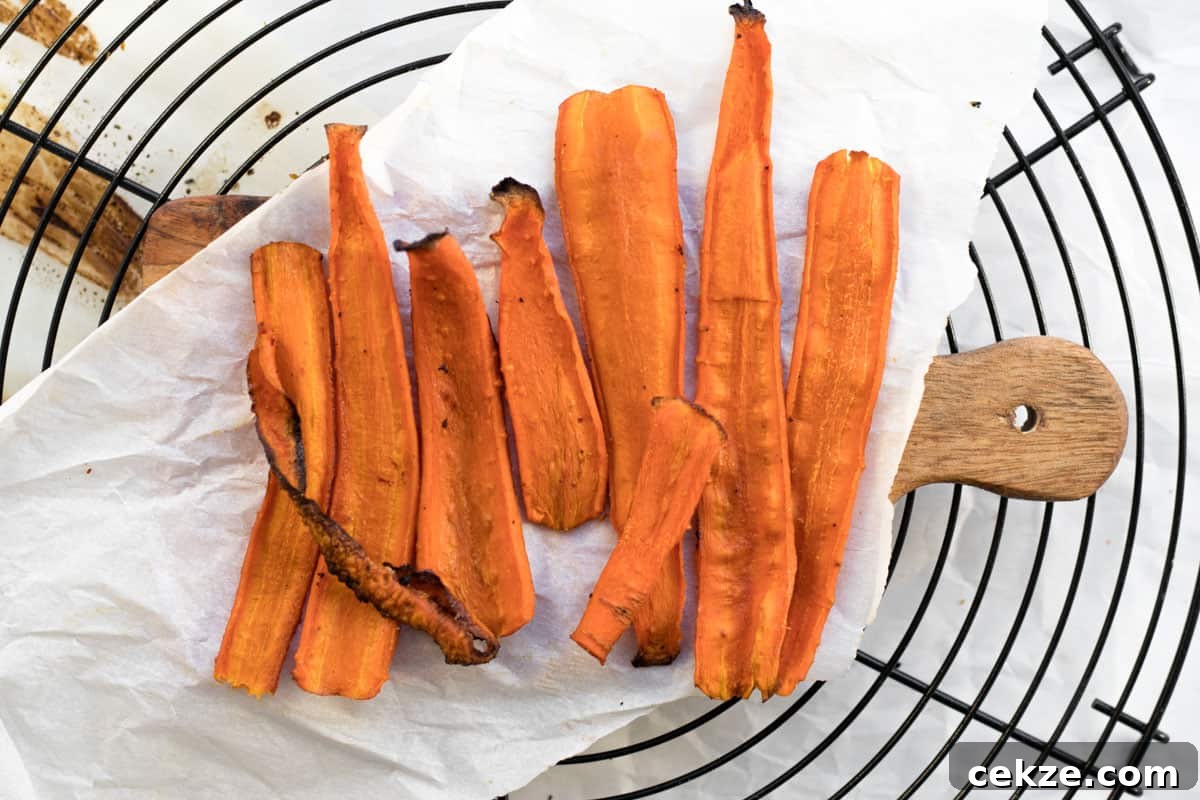 Crispy Bacon-Roasted Carrots with Maple Glaze 2 carrot bacon on a cooling rack
