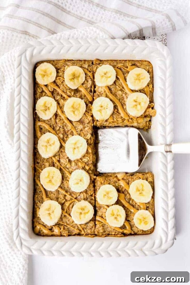 Peanut butter and banana baked oatmeal in a large white baking dish.