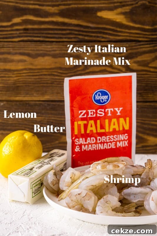 Garlic Butter Lemon Shrimp Recipe with Garlic-Parsley Sauce 4 Lemon, butter, shrimp, and Zesty Italian Salad Dressing and Marinade Mix on counter.