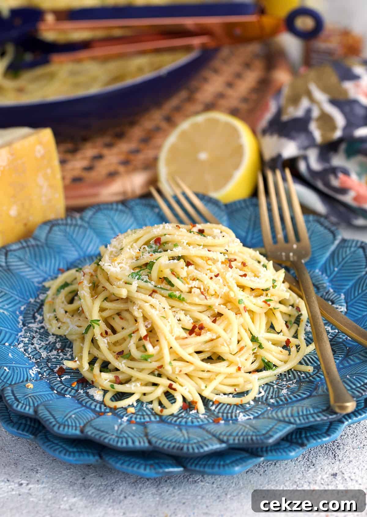 Classic Spaghetti Aglio e Olio: Simple Garlic Olive Oil Pasta Recipe 8 spaghetti aglio e olio on a blue plate
