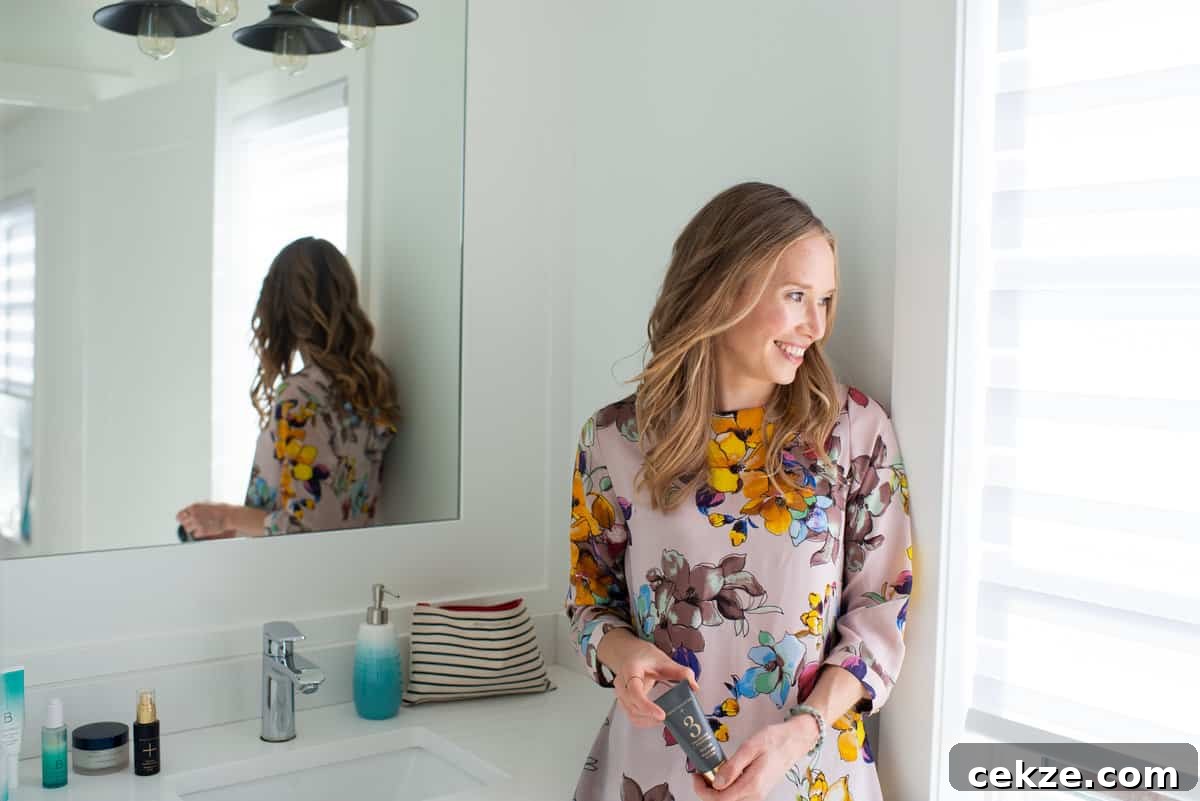 Why I Joined Beautycounter as a Doctor: My Experience and Reasons 3 Erin Carter in her bathroom holding a charcoal mask.