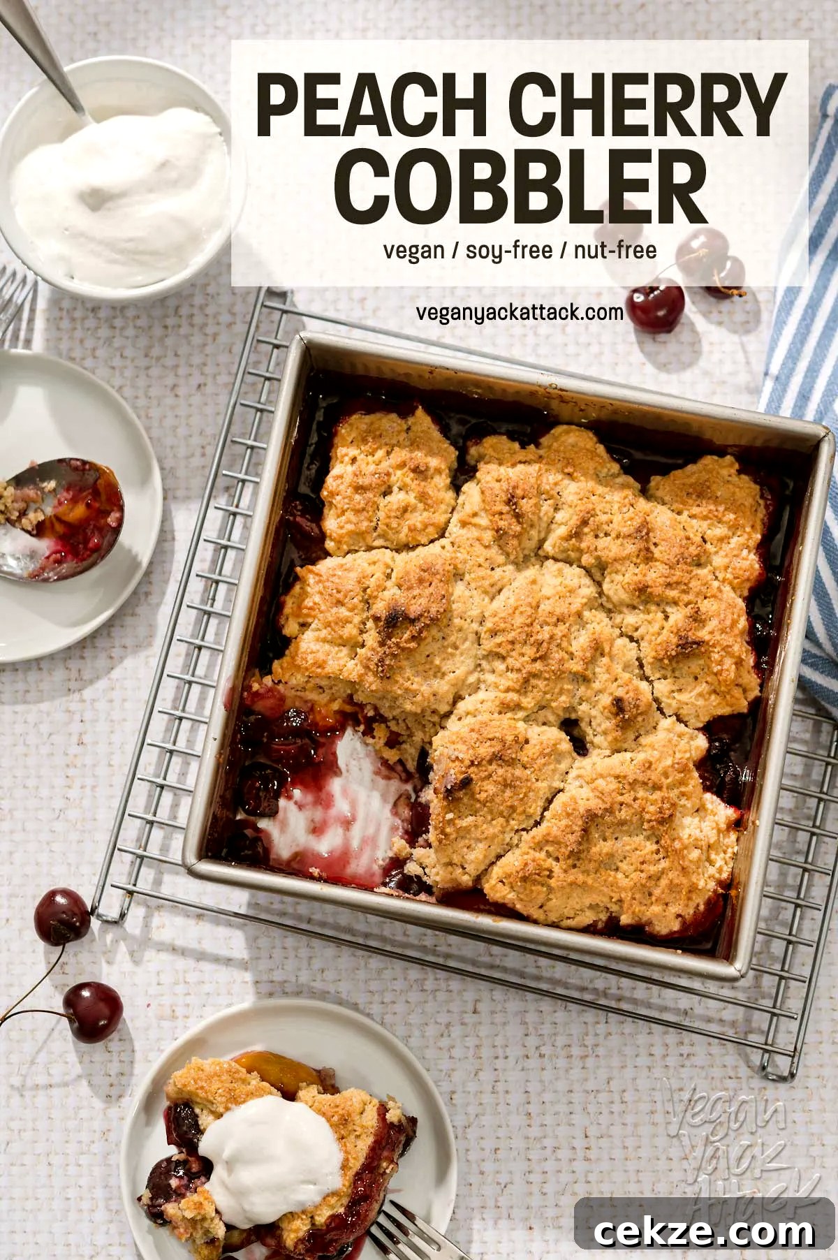 Square baking dish of fruit cobbler on a wire rack, on a white table cloth
