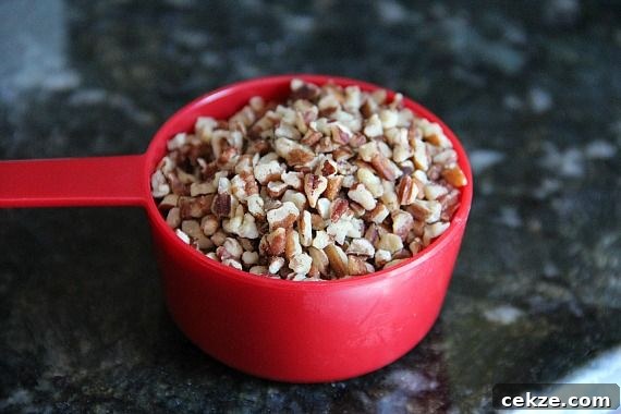 Chopped nuts in a measuring cup