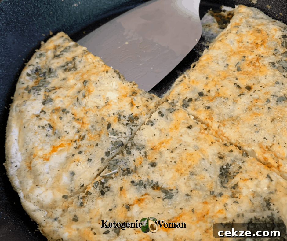 Keto Pizza in pan cut into 4 pieces