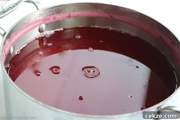 Cold raspberry iced tea in pitcher
