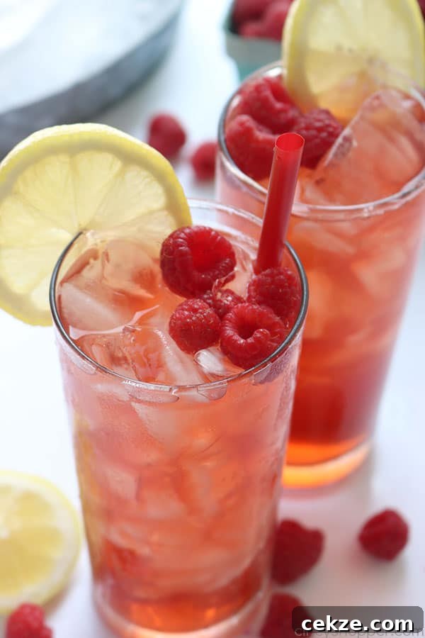 Glass of raspberry iced tea with ice