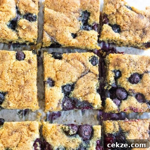blueberry blondies recipe cut into bars on cutting board