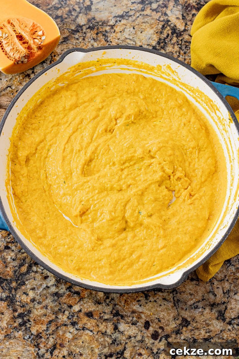 blended up butternut squash in a large skillet