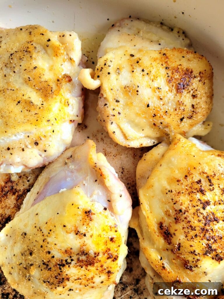 seared chicken thighs in a skillet