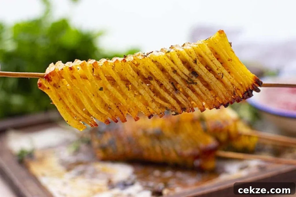 49 TikTok Recipes That Truly Live Up to the Hype 15 A skewer with an accordian cut potato.