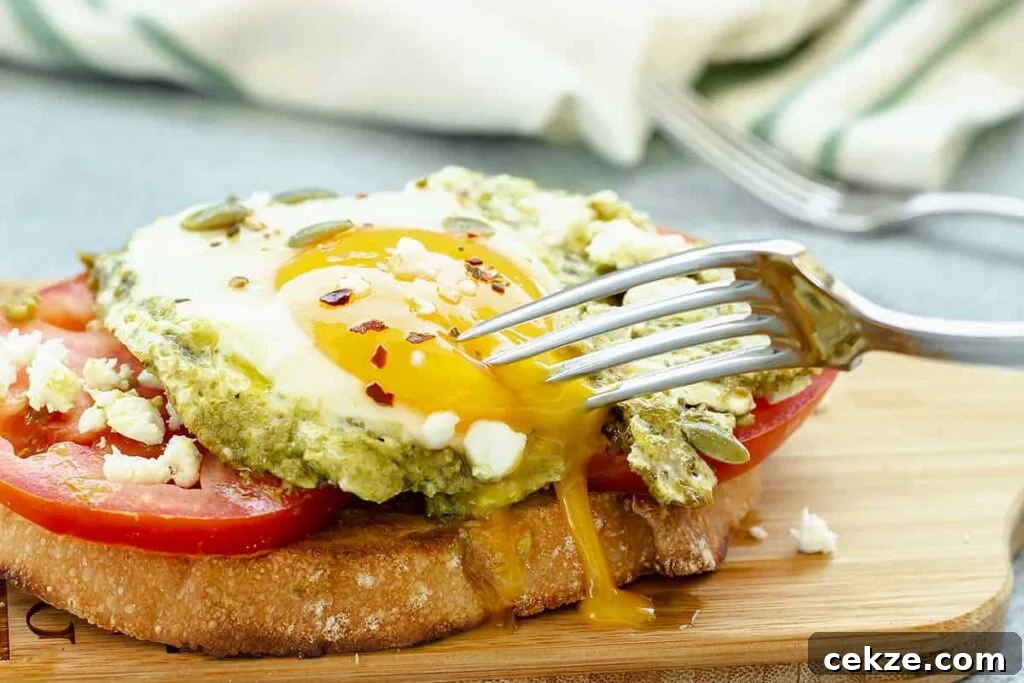 49 TikTok Recipes That Truly Live Up to the Hype 24 Toast topped with eggs and pesto on a wooden platter