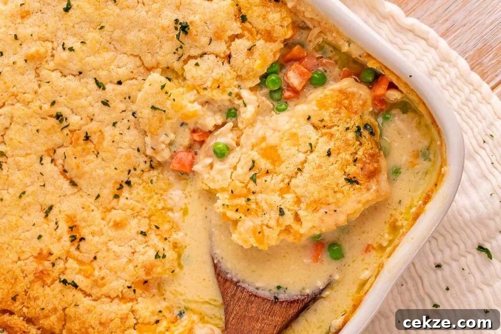 49 TikTok Recipes That Truly Live Up to the Hype 29 Scooping chicken cobbler from a pan.