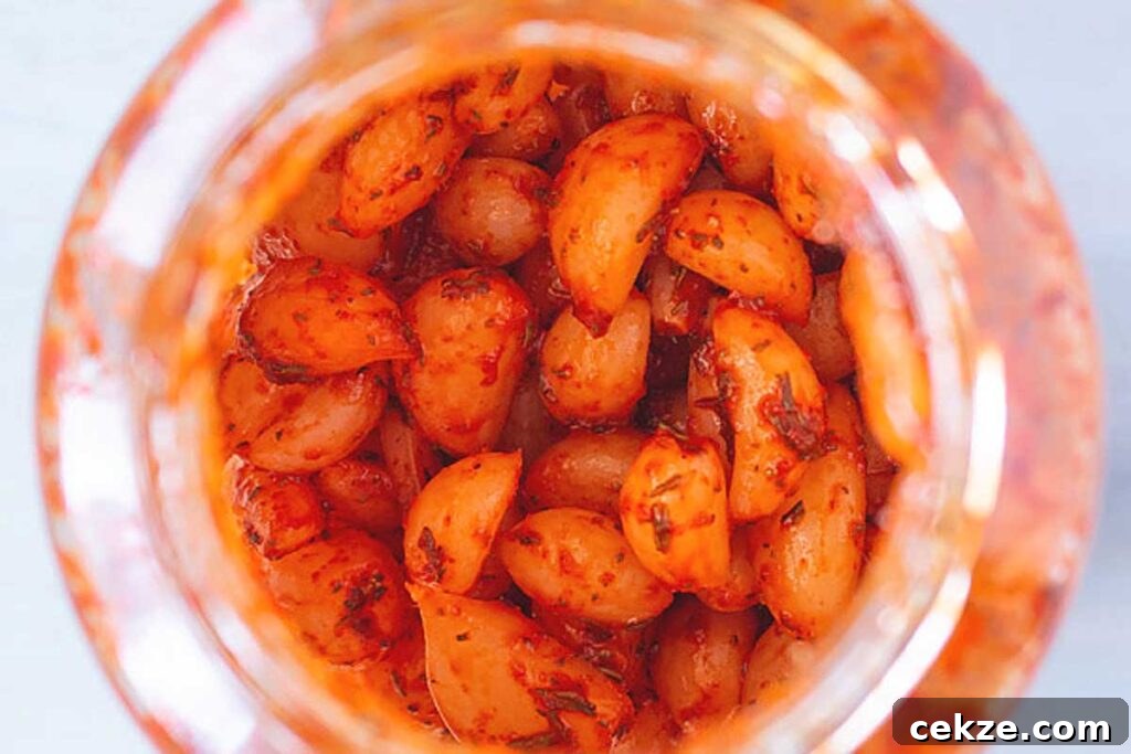 49 TikTok Recipes That Truly Live Up to the Hype 48 Overhead shot of pickled garlic in a jar