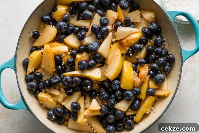 Pear and Blueberry Crisp Recipe for Warm, Fruity Dessert 6 Tapioca pearls and blueberries stirred into softened pears.