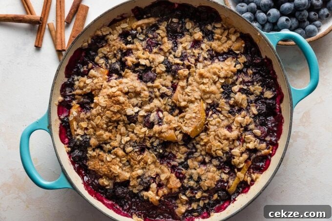 Pear and Blueberry Crisp Recipe for Warm, Fruity Dessert 8 Just-baked pear and blueberry crisp pulled out of the oven and cooling on the counter.