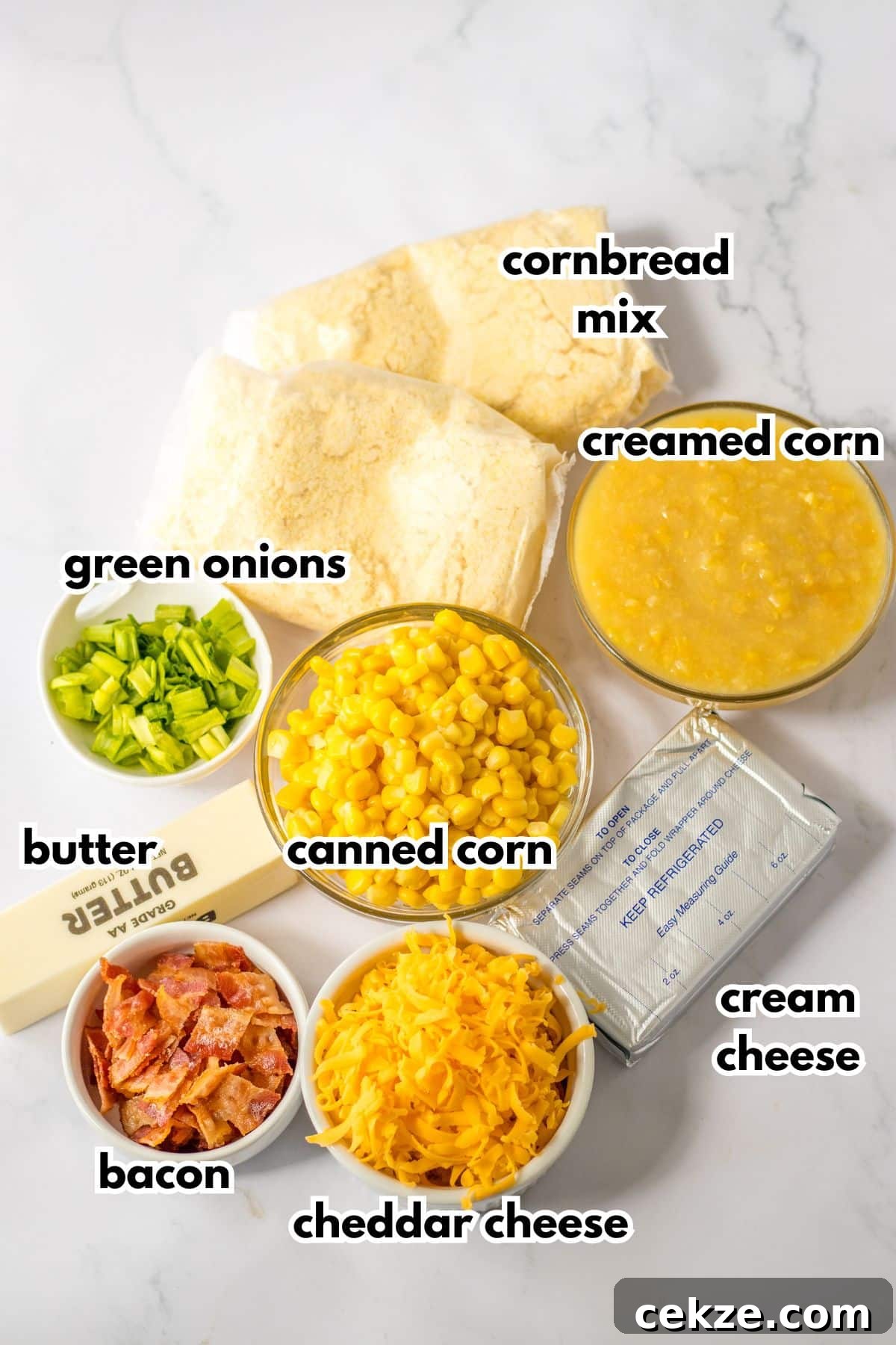 Loaded Cornbread Casserole Recipe — Cheesy Bacon & Jalapeño Bake 4 cornbread mix, green onions, butter, canned corn, bacon, cheddar cheese, and cream cheese