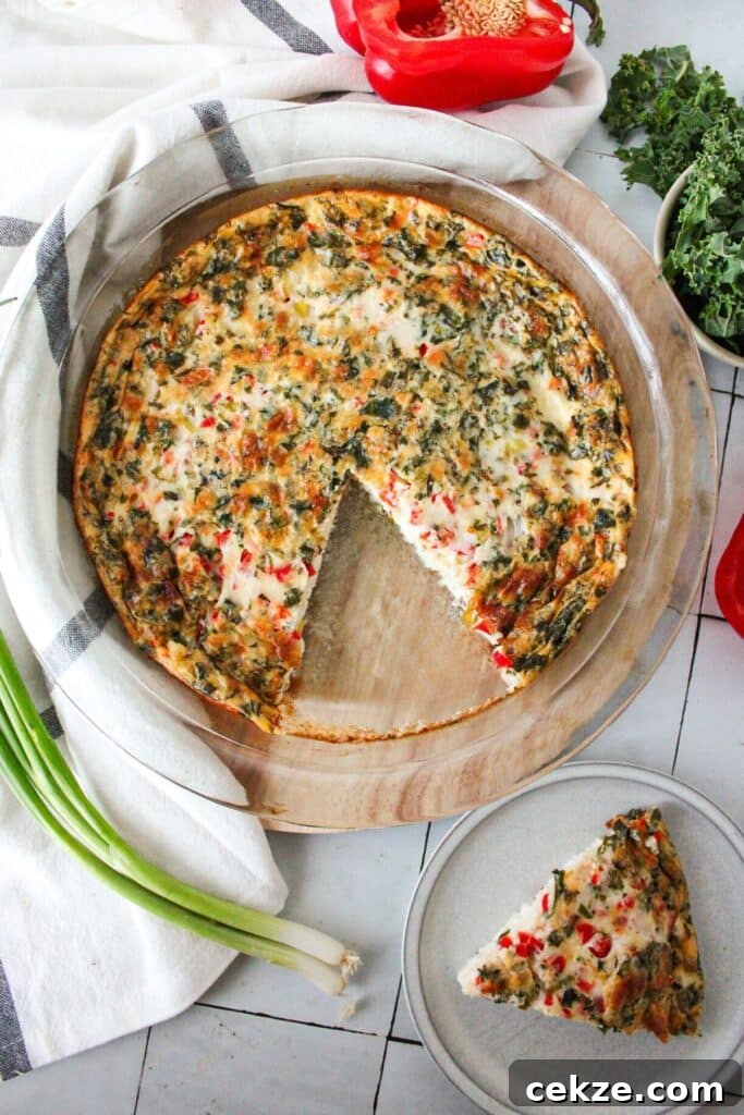 An egg white quiche with a slice cut out.