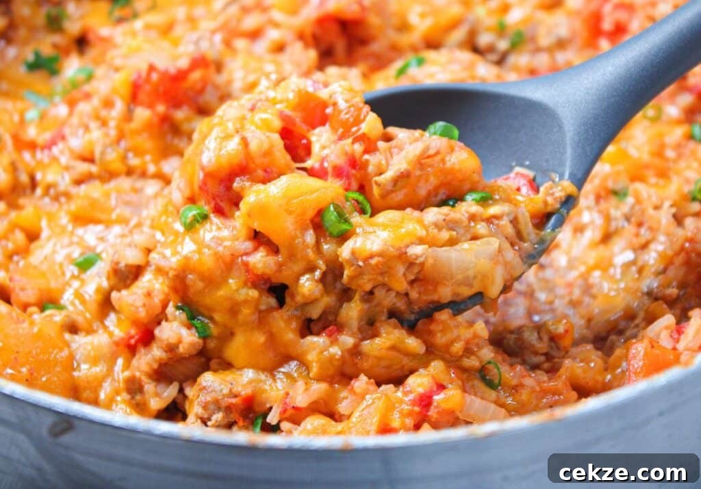 A large pan of deconstructed stuffed peppers in a skillet.