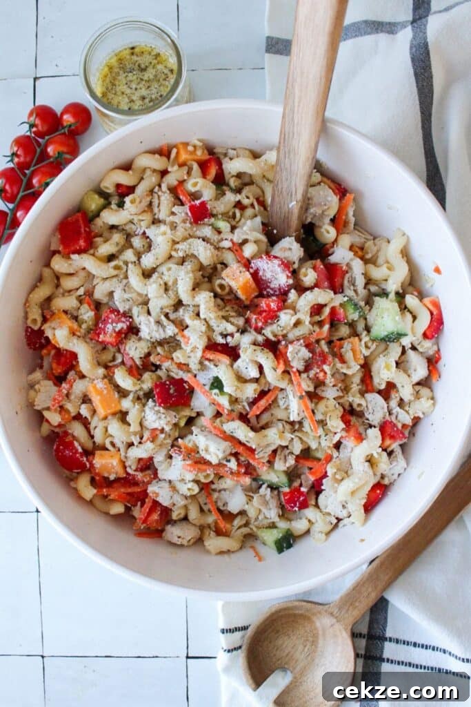 A large bowl of mixed high protein pasta salad.