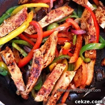 chicken fajitas in a pan.