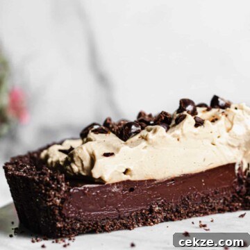 the cross section of the chocolate espresso tart to showcase each layer.
