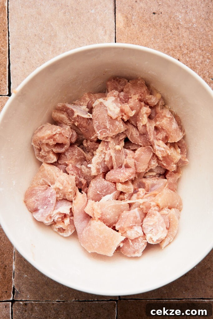 chicken cut into bite sized pieces and tossed with starch in a large mixing bowl 