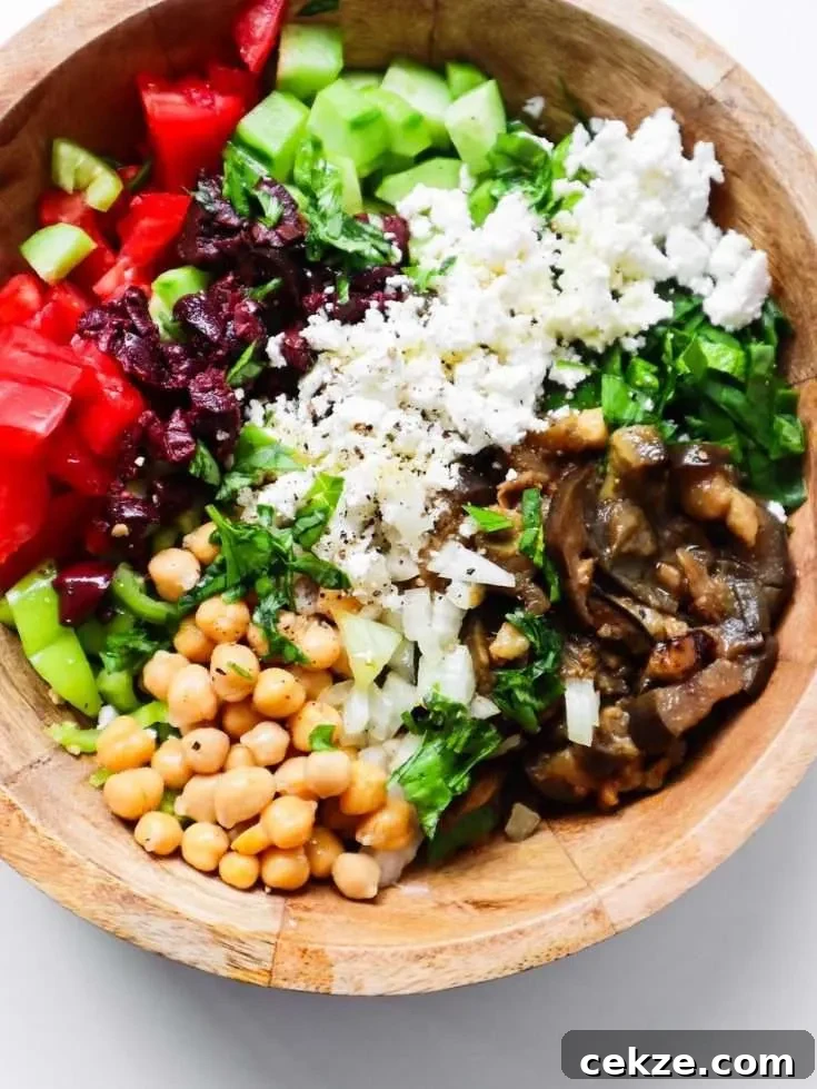 Healthy chickpea eggplant salad - a tasty Mediterranean side dish with some cooked meat or fish or as an easy healthy lunch on its own. You'll need roasted or grilled eggplant, canned chickpeas, raw veggies and feta cheese.