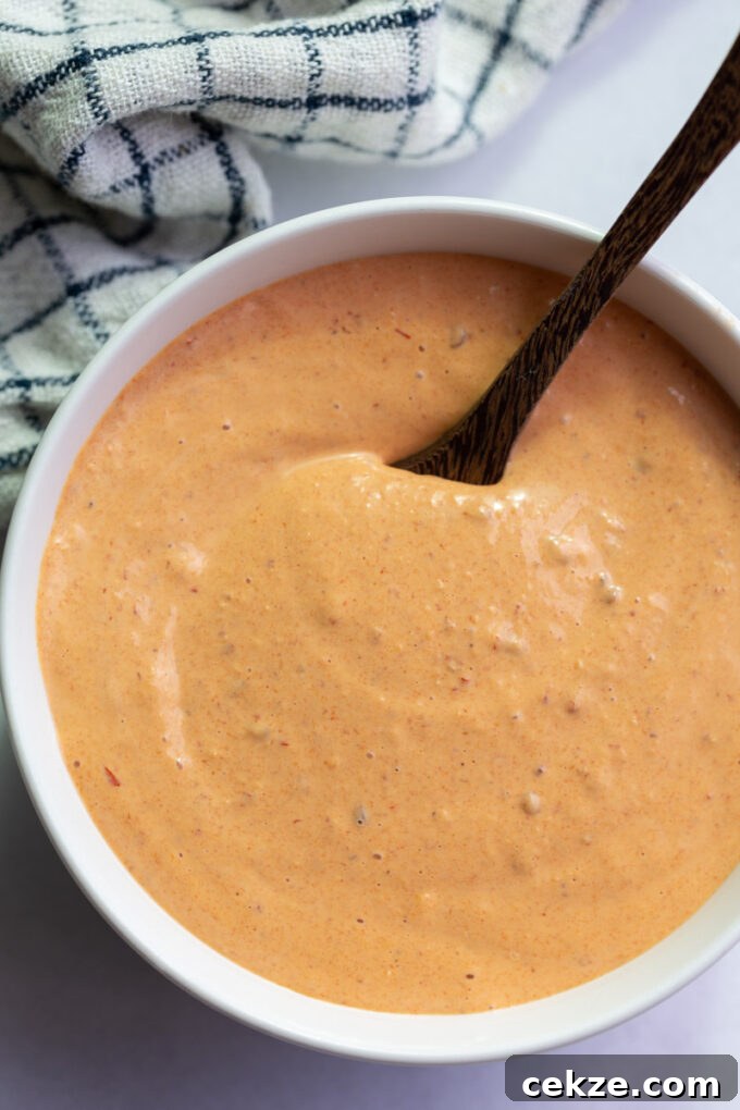 chipotle mayo sauce in a large white bowl with a spoon