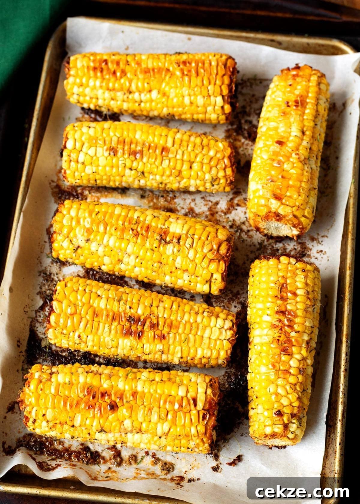 Oven Roasted Corn on the Cob on a baking pan.