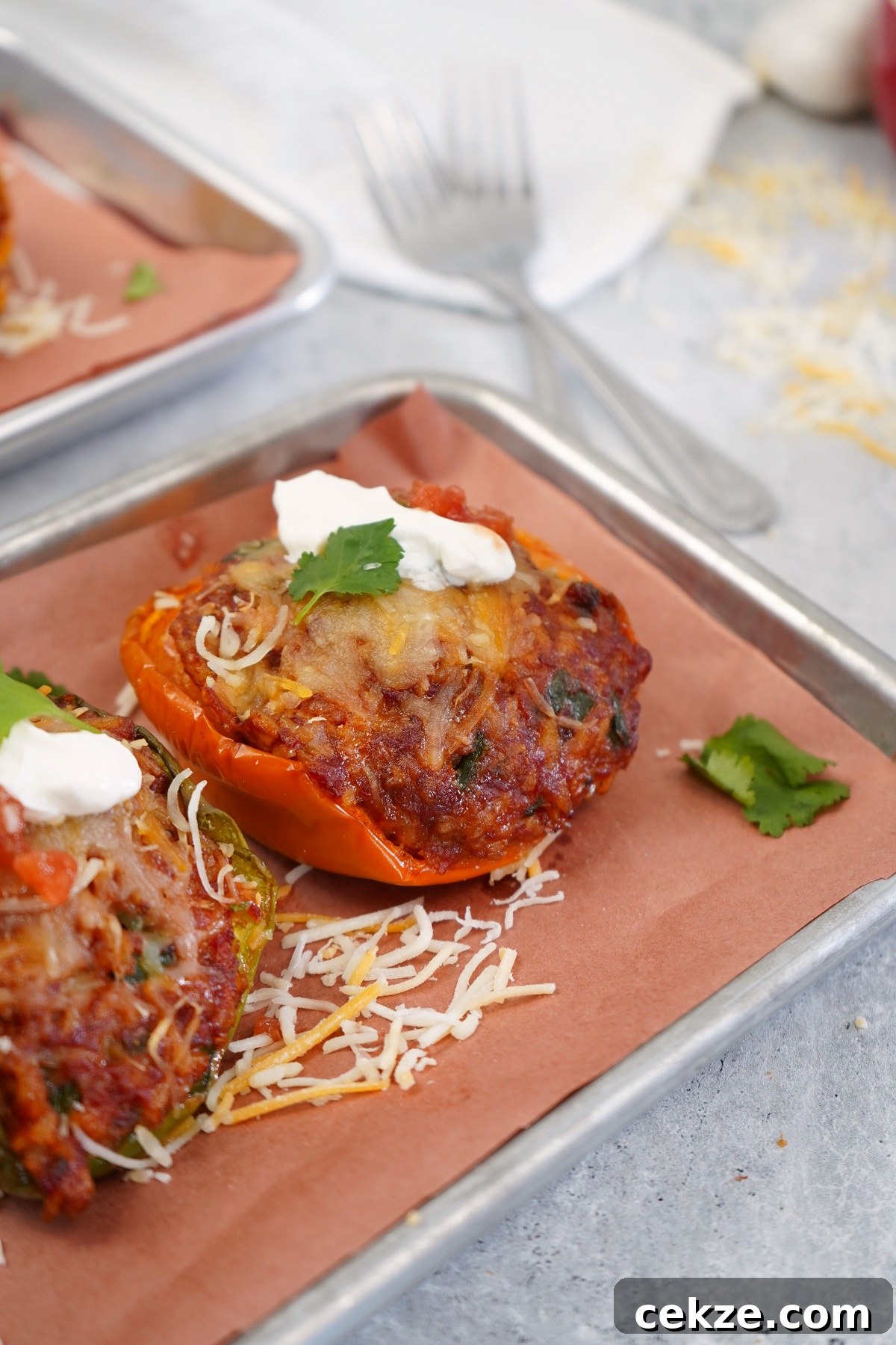 Smoked chorizo stuffed bell peppers on serving platter.