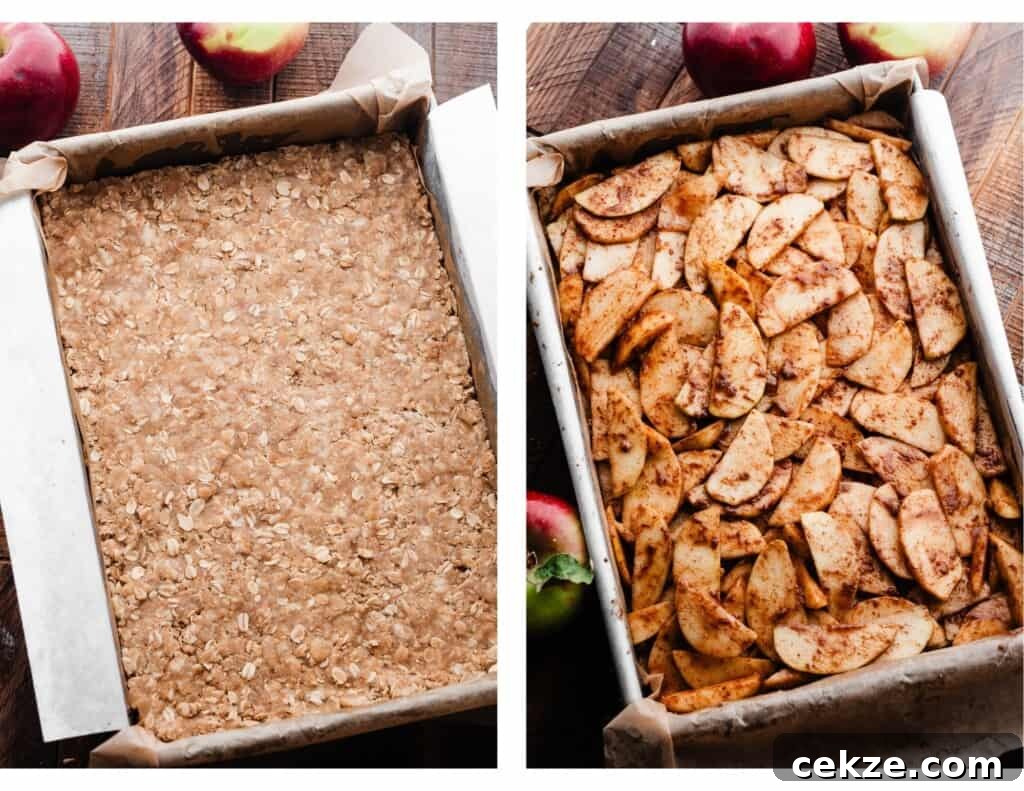 Apple slices being layered over the base of the bars.