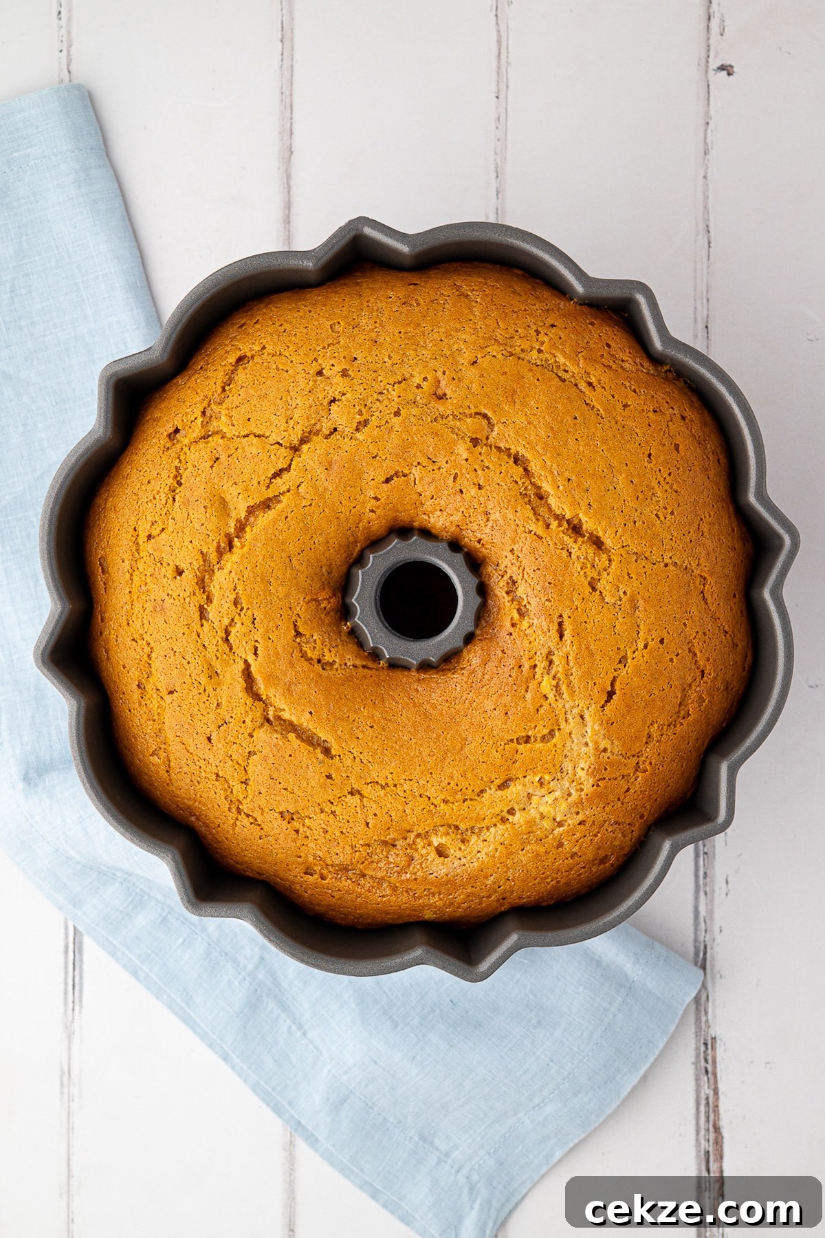 cake in bundt pan after baking with golden brown edges