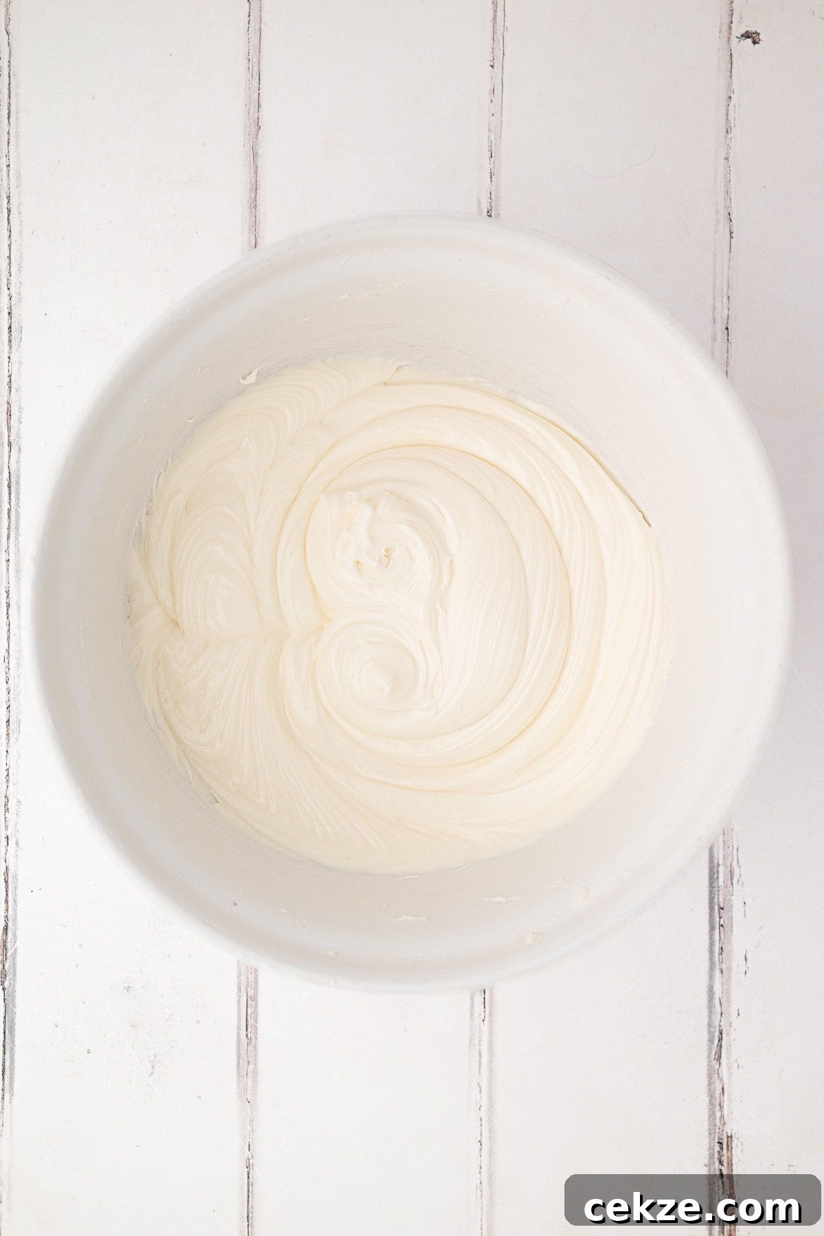 whipped cream cheese frosting in a bowl
